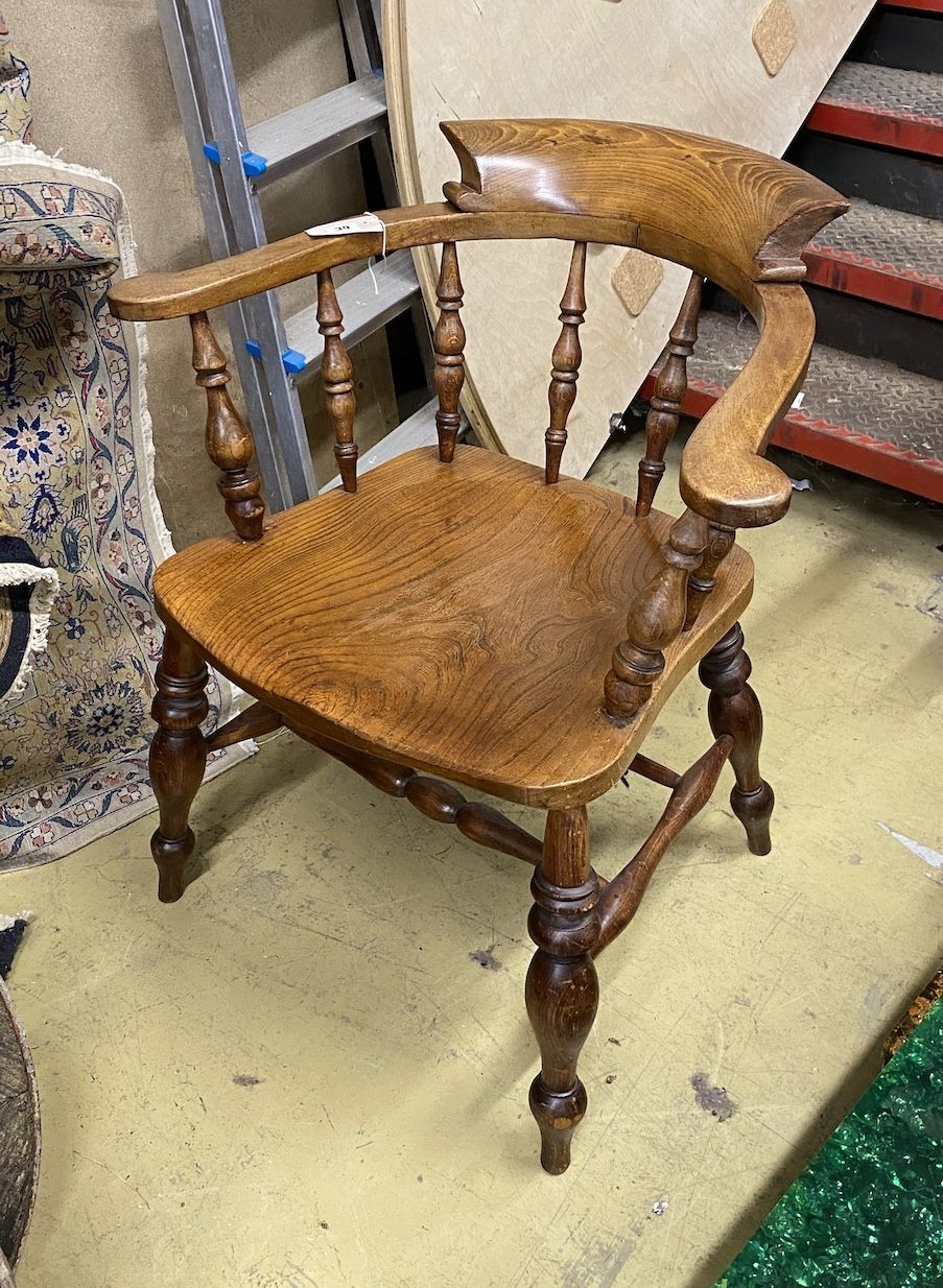 A Victorian beech and elm smoker's bow chair